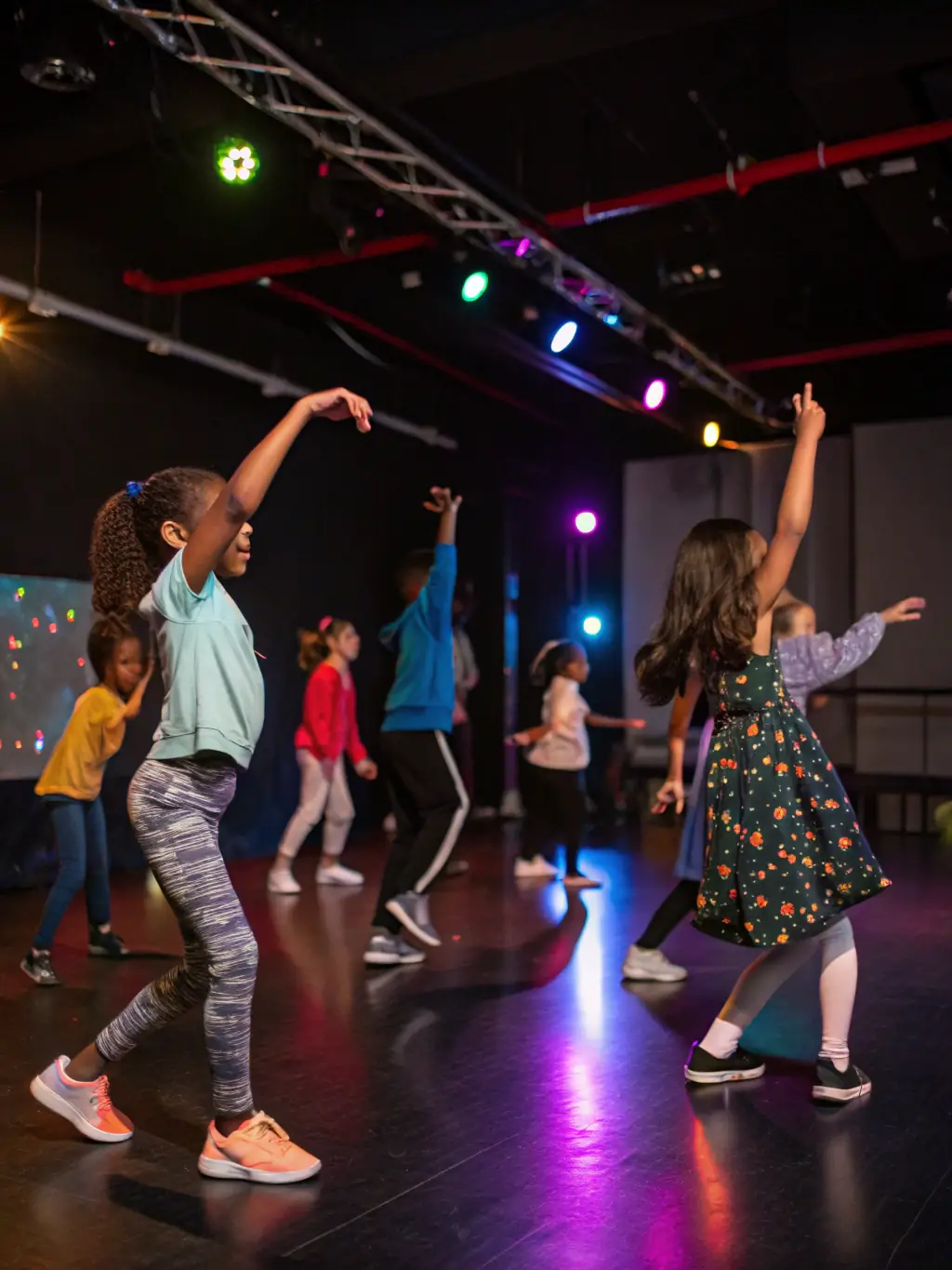 A vibrant scene from a community dance class at ASSOCIATION DE LA MAISON MALADIERE, with participants of all ages learning new moves and enjoying the music.